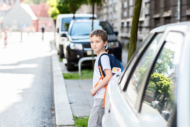 boy crossing a road