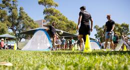 a group of people on a field with a football ball