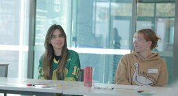 a couple of people sitting at a table