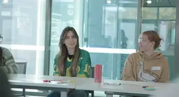 a couple of people sitting at a table