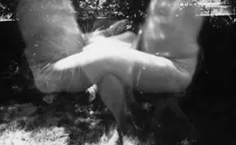 a blurry image of a couple of people sitting outside