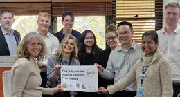 a group of people holding a sign
