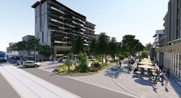 a street with trees and people in front of a building