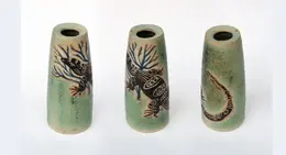a group of vases with designs