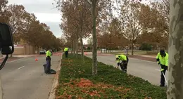 a group of people in reflective vests on a street