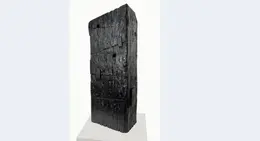 a black rectangular object on a white surface