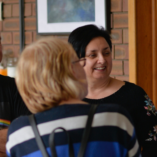 A group of neighbours talking together.
