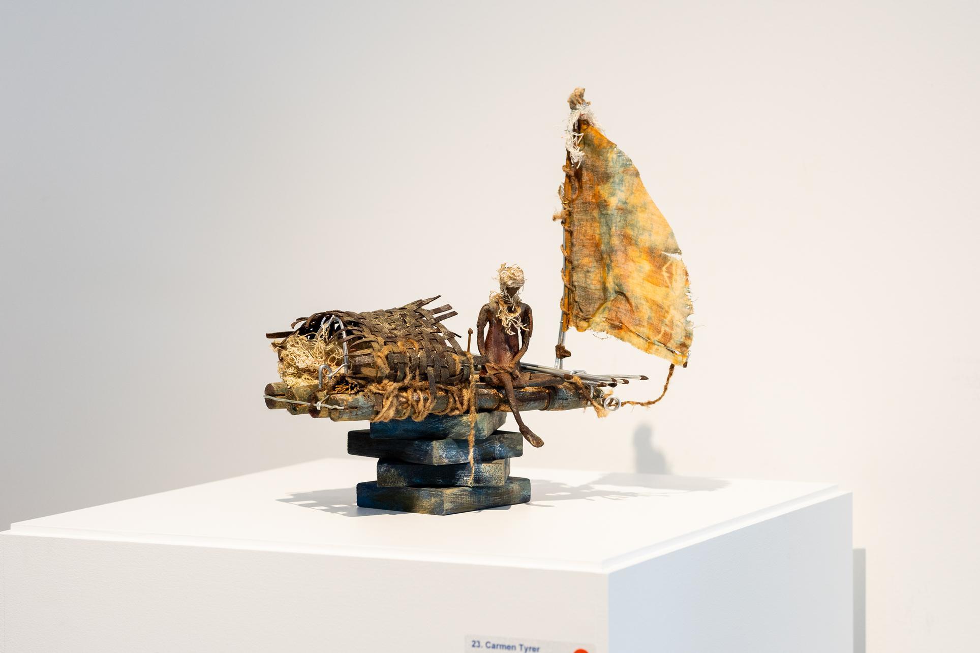 a sculpture on a white surface