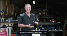 a man standing in a garage