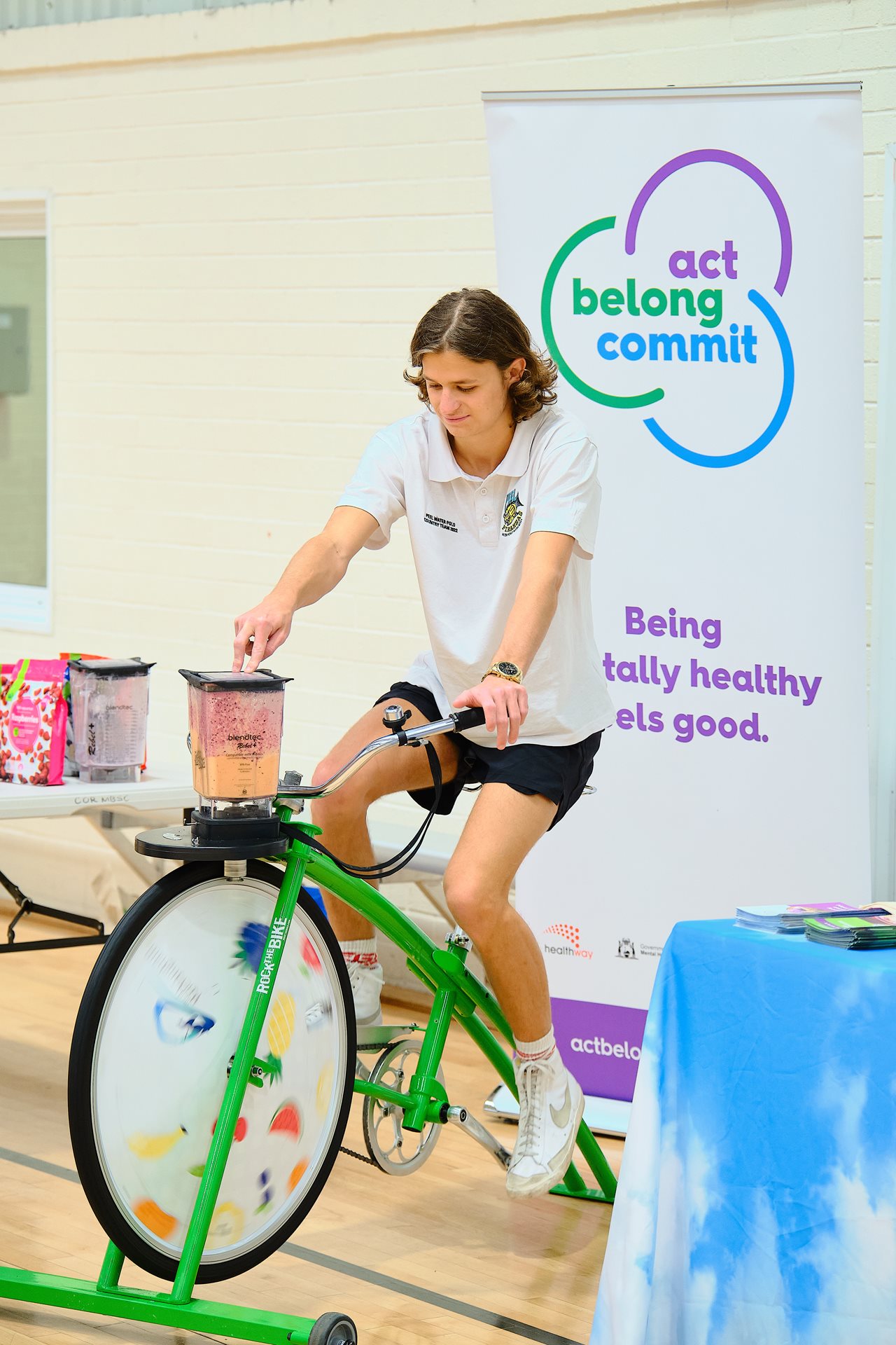 Person riding a blender bike at a City event.