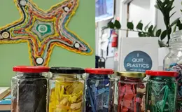 a group of glass jars with different objects in them