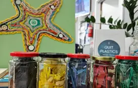 a group of glass jars with different objects in them