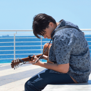 A young musician playing guitar at The Lookout, Rockingham Foreshore