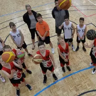 a group of kids holding basketballs