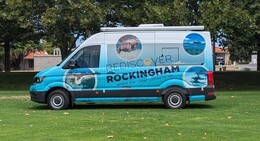 a blue van with a blue and black logo on it