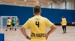 a man in a yellow shirt