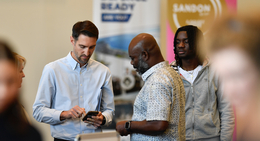 a group of men standing in a room