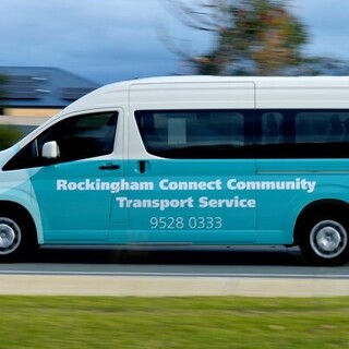 a blue and white van on the road