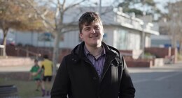 a man in a black coat