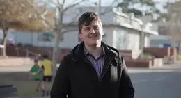 a man in a black coat