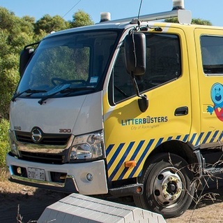 a man standing next to a truck