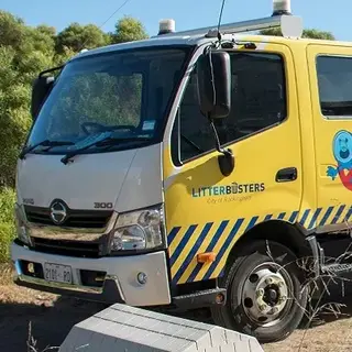 a man standing next to a truck