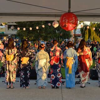 a group of women wearing kimonos