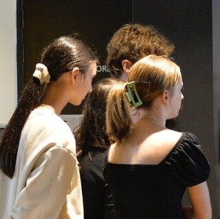 a woman standing next to a machine