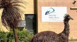 Sculptures of emus in front of the Safety Bay Library building.
