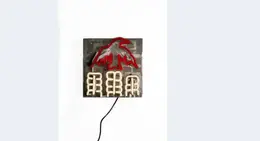 a black cord with a red and white eagle on it