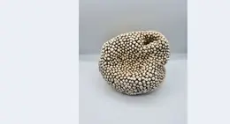 a white object with small white dots