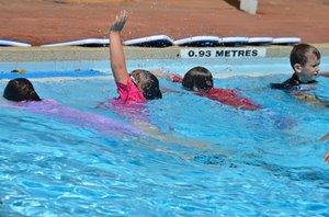 Children learning to swim