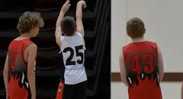 a group of boys in a basketball uniform