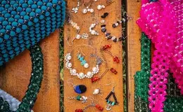 a group of jewelry on a bench