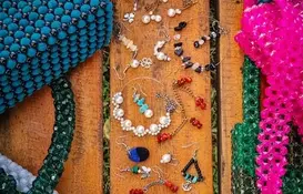 a group of jewelry on a bench