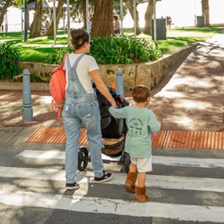 A family crossing a zebra crossing toward Churchill Park, Rockingham Foreshore.