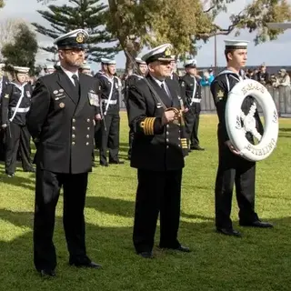 a group of people in uniform standing in a line