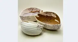 a group of bowls with designs on them